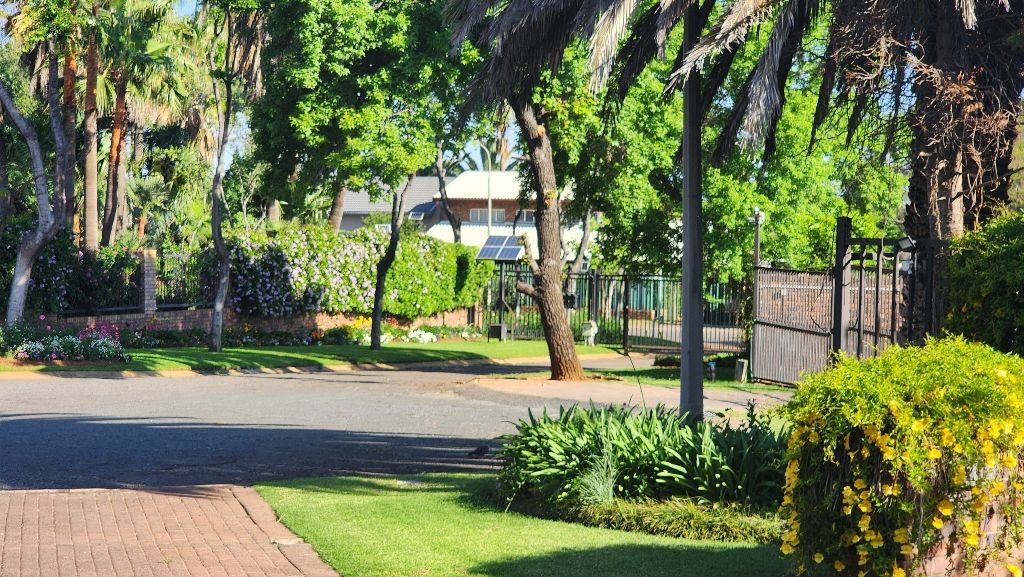 Exterior View - Beautiful entrance gate and landscaping