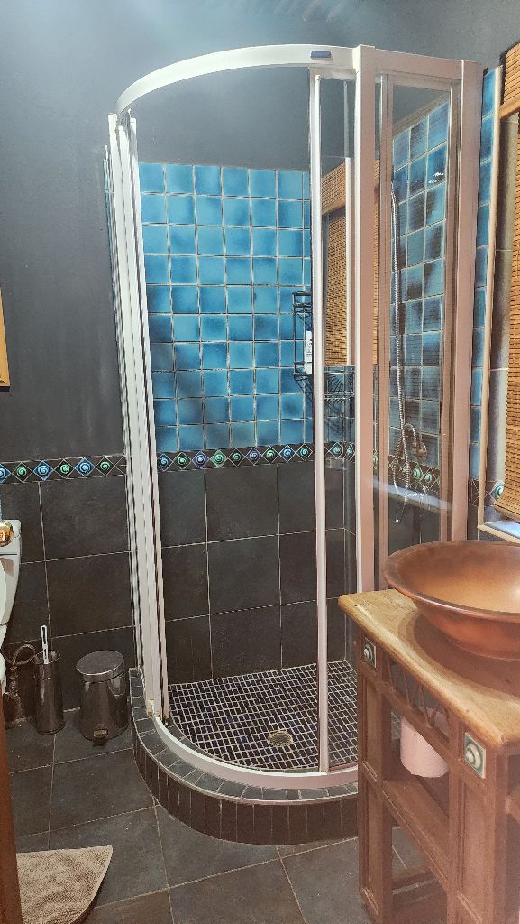 Rustic Room - Luxury bathroom with curved shower